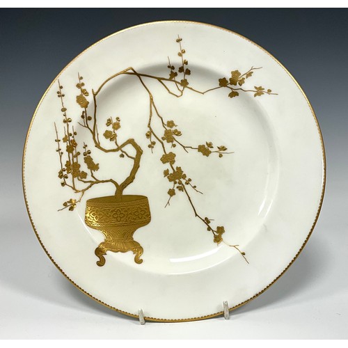 343 - A Minton porcelain Aesthetic Movement plate, decorated in gilt with a Japonesque vessel and blossomi... 