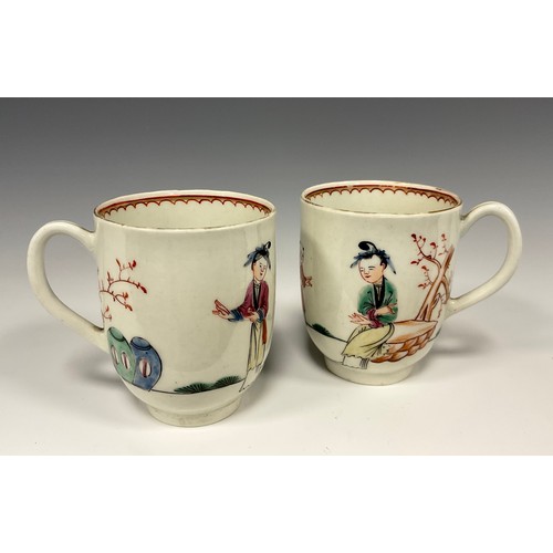 346 - A pair of 18th century Worcester porcelain coffee cups, c.1760-1770, each decorated in polychrome en... 