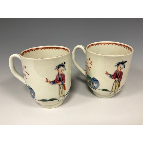 346 - A pair of 18th century Worcester porcelain coffee cups, c.1760-1770, each decorated in polychrome en... 