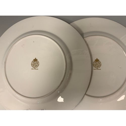 347 - A pair of Royal Worcester hand painted cabinet plates, the central panels with Peaches and Berries a... 