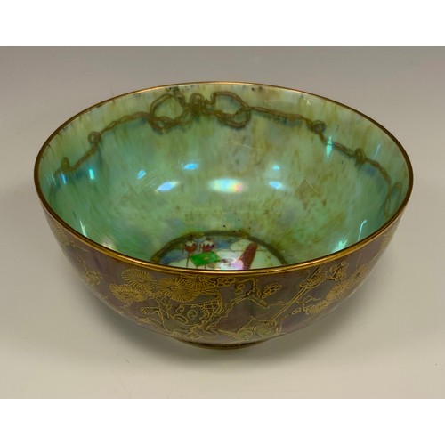 318 - A Wedgwood Fairyland Lustre Firbolgs pattern bowl designed by Daisy Makeig-Jones, the exterior in bl... 