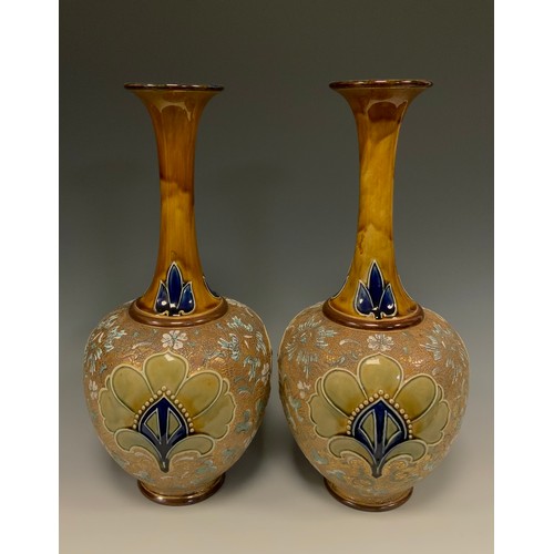 310 - A pair of Royal Doulton Art Nouveau Chine ware vases, shape number 5790, with elongated necks, decor... 