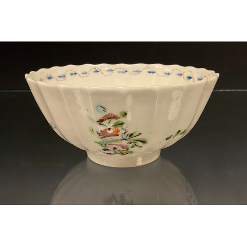 356 - A Pinxton porcelain fluted bowl, painted with floral sprays in tones of russet, green, blue, pink an... 