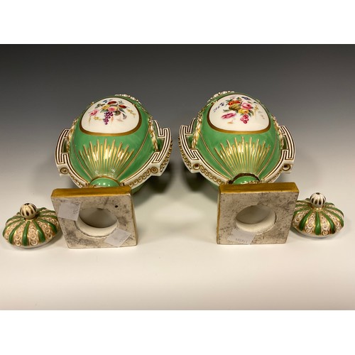 354 - A pair of 19th century Porcelain urn vases and covers, each painted with panels of Fruit and flowers... 