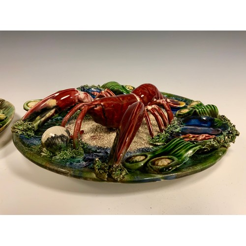 361 - A 20th century Continental Majolica lobster plate, 28cm diameter; a similar smaller crab plate, 22cm... 