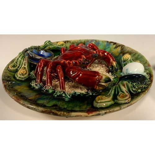 361 - A 20th century Continental Majolica lobster plate, 28cm diameter; a similar smaller crab plate, 22cm... 