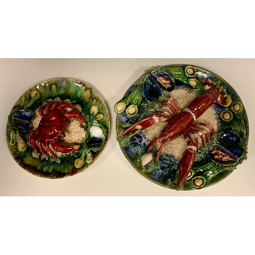 361 - A 20th century Continental Majolica lobster plate, 28cm diameter; a similar smaller crab plate, 22cm... 