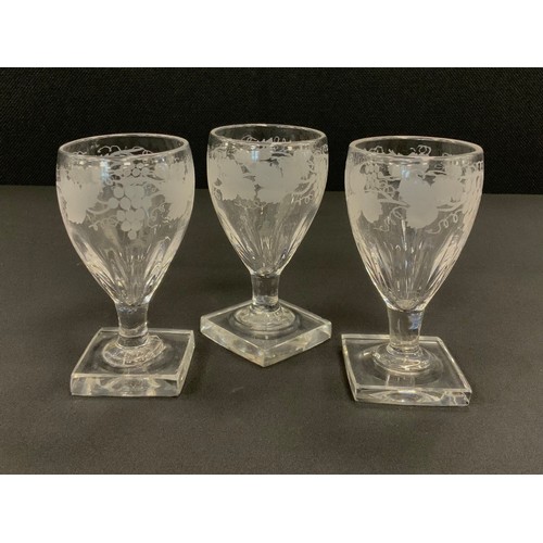 394 - A set of five George III hand engraved Rummers, with grape vine collar, square bases, 11.5cm high, 7... 