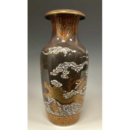 415 - A Japanese porcelain Meiji period vase, decorated with a Dragon and Phoenix in white, green, red ,bl... 