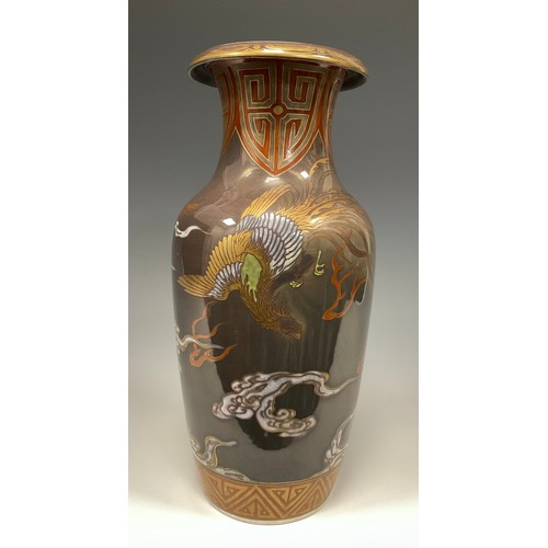 415 - A Japanese porcelain Meiji period vase, decorated with a Dragon and Phoenix in white, green, red ,bl... 