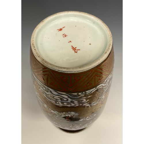 415 - A Japanese porcelain Meiji period vase, decorated with a Dragon and Phoenix in white, green, red ,bl... 