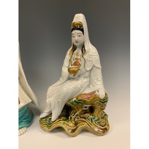 418 - A Japanese Shōwa period Kutani figure of Kannon (Guanyin), 49.5cm high;  another similar smaller sea... 