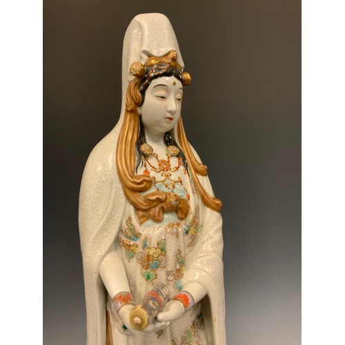 418 - A Japanese Shōwa period Kutani figure of Kannon (Guanyin), 49.5cm high;  another similar smaller sea... 