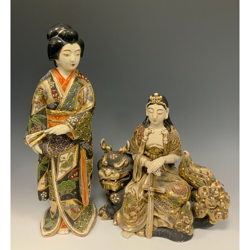 419 - A Japanese Shōwa period Satsuma figure of a standing Geisha, 38cm high;  and another similar figure,... 