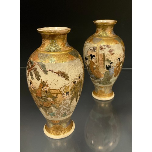 429 - A pair of Japanese Satsuma baluster vases, decorated with panels of Samurai and ladies within typica... 