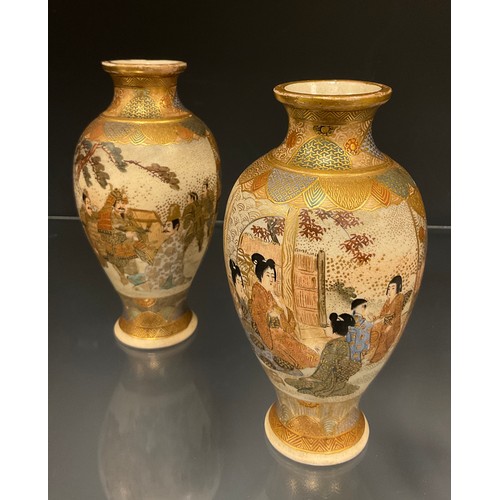 429 - A pair of Japanese Satsuma baluster vases, decorated with panels of Samurai and ladies within typica... 