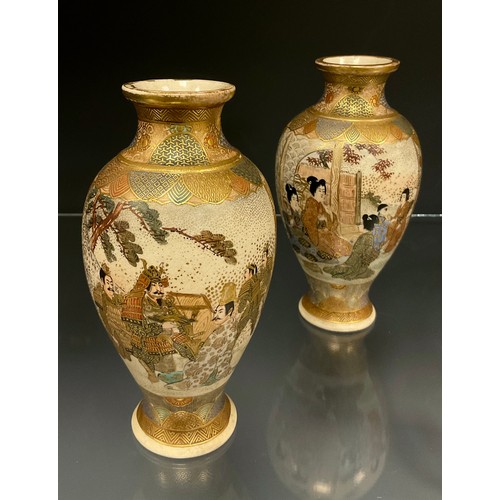 429 - A pair of Japanese Satsuma baluster vases, decorated with panels of Samurai and ladies within typica... 