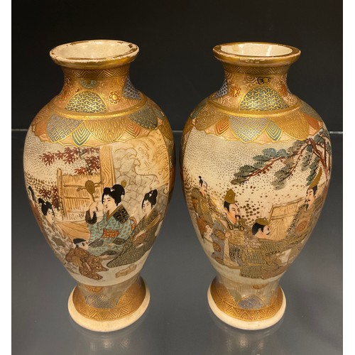 429 - A pair of Japanese Satsuma baluster vases, decorated with panels of Samurai and ladies within typica... 