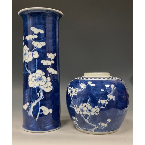 408 - A Chinese sleeve vase, painted in tones of underglaze blue with blossoming prunus on a ground of cra... 