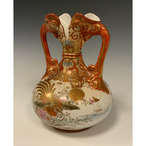 413 - A Japanese Meiji period Kutani porcelain vase, the twin handled body painted with Peacocks and flowe... 