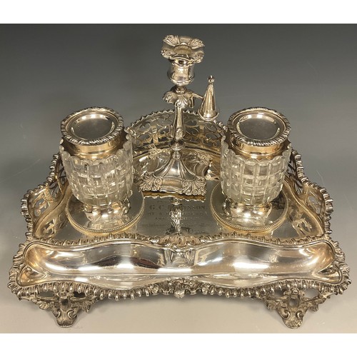 133 - A Victorian Elkington & Co inkstand, the rounded triangular base with pierced gallery back, two lidd... 