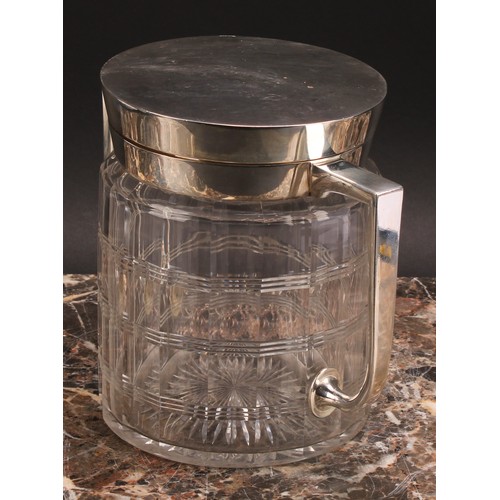 135 - An Arts and Crafts E.P.N.S mounted clear glass biscuit box, of Christopher Dresser influence, hinged... 