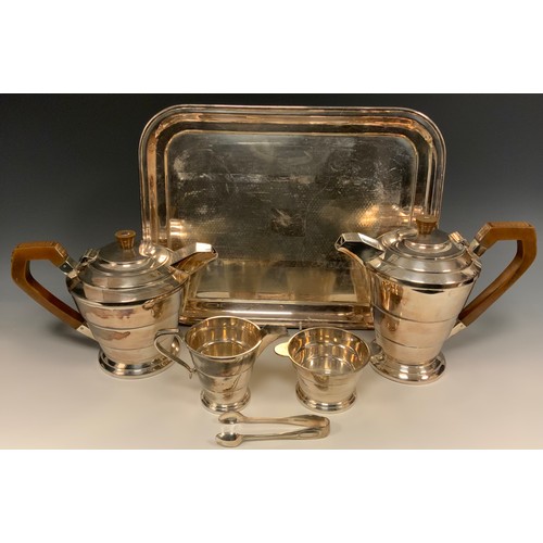 134 - An Art Deco E.P.N.S four piece tea service, comprising teapot, hot water pot, milk jug and sugar bas... 