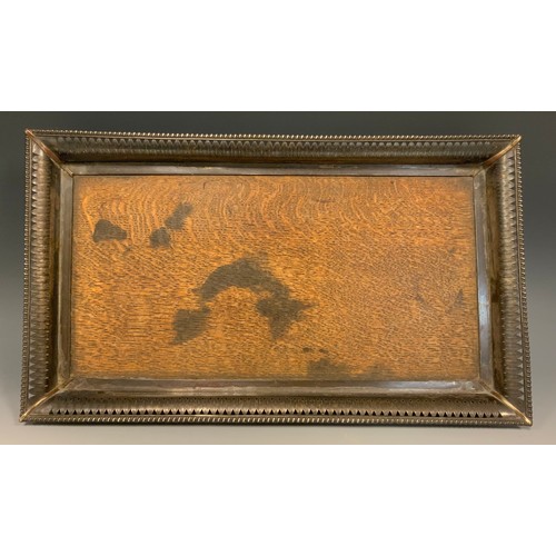 136 - An Edwardian E.P on copper mounted oak rectangular tray, outswept gallery pierced and embossed with ... 