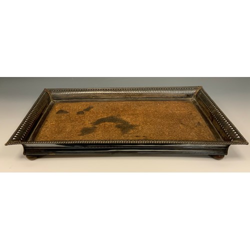 136 - An Edwardian E.P on copper mounted oak rectangular tray, outswept gallery pierced and embossed with ... 