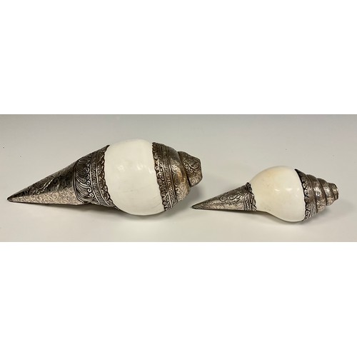 39 - ***COLLECTING BACK***
A graduated pair of low grade silver mounted shells. embossed with floral pane... 