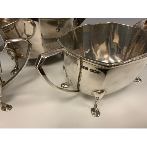 35 - A George V silver four piece tea set, comprising Ebony handed Teapot and Hot water jug, twin handled... 