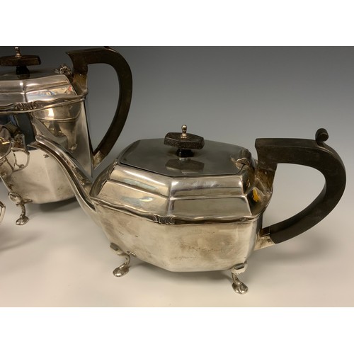 35 - A George V silver four piece tea set, comprising Ebony handed Teapot and Hot water jug, twin handled... 