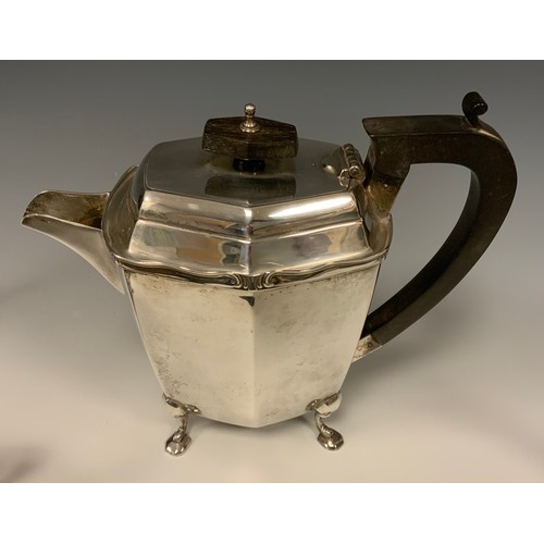 35 - A George V silver four piece tea set, comprising Ebony handed Teapot and Hot water jug, twin handled... 