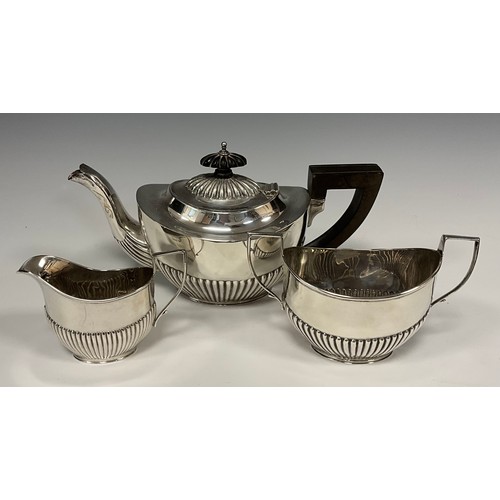 97 - An Edwardian silver Batchelors tea set, Tea pot with ebonised handle, milk jug and sugar bowl, gadro... 