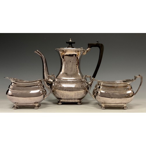 108 - An Elizabeth II silver three piece coffee set comprising ebony handled rounded rectangular coffee po... 