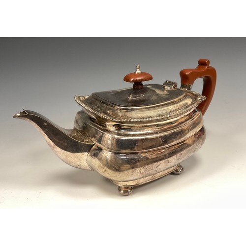 107 - An Elizabeth II silver tea pot, of rounded rectangular form, gadrooned and shell detailed lip, woode... 