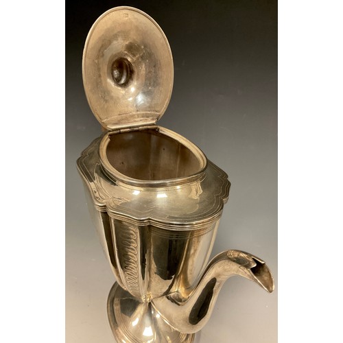 5 - A George III silver coffee pot, with shaped tapering oval body bright-cut engraved with formal borde... 