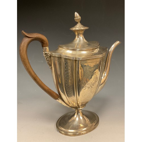 5 - A George III silver coffee pot, with shaped tapering oval body bright-cut engraved with formal borde... 