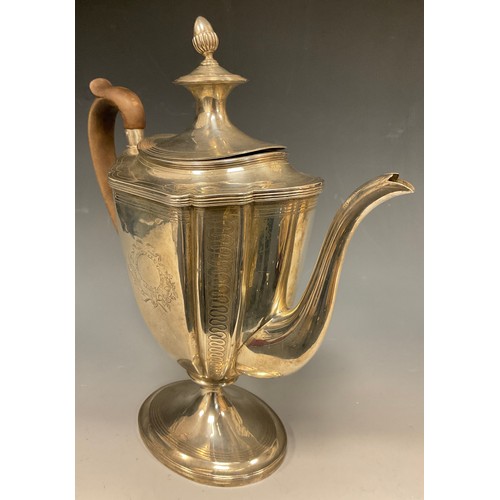 5 - A George III silver coffee pot, with shaped tapering oval body bright-cut engraved with formal borde... 