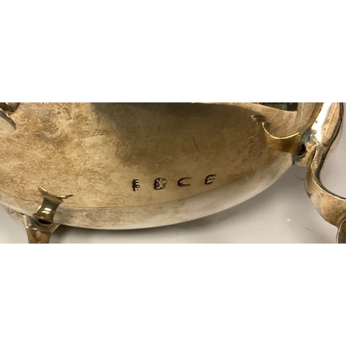 16 - A George III silver sauce boat, monogrammed FMM, gadrooned rim, acanthus leaf capped scrolling handl... 