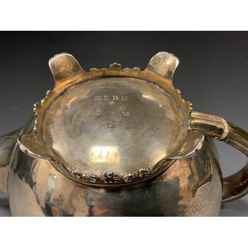 26 - A William IV silver teapot, plain ovoid body, arched handle with slightly of set thumb piece, ornate... 