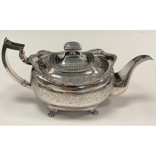 1 - A George III Irish silver teapot, cast and chased ovoid body, shaped rim, floral collar, paw feet, 	... 