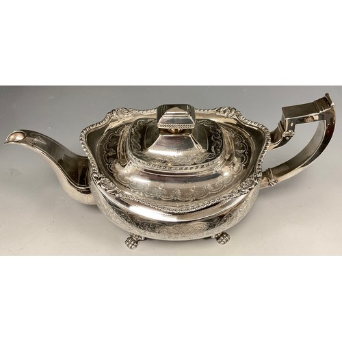 1 - A George III Irish silver teapot, cast and chased ovoid body, shaped rim, floral collar, paw feet, 	... 