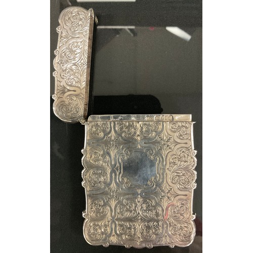 114 - Nathaniel Mills - a Victorian silver shaped rectangular visiting card case, embossed with panels of ... 