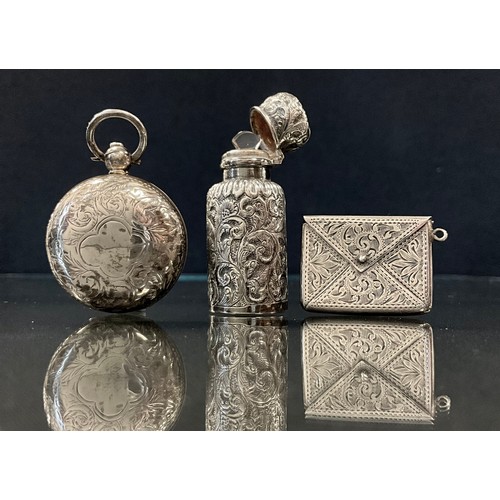 87 - A Victorian silver miniature scent bottle, embossed floral decoration, Birmingham 1886; Sovereign ca... 