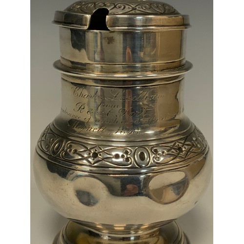 86 - A Victorian silver lidded tankard, waisted body with Celtic band of scrolling motif and rings, shape... 