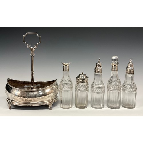 33 - A George IV silver five bottle cruet stand, boat shaped stand, central carrying handle, with five cu... 