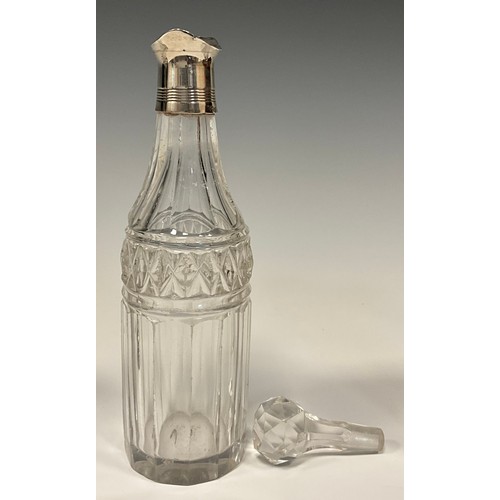 33 - A George IV silver five bottle cruet stand, boat shaped stand, central carrying handle, with five cu... 