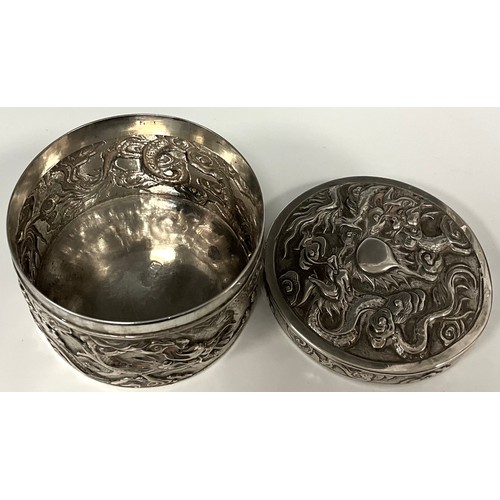 138 - A Chinese silver embossed cache pot, decorated with Dragons chasing the Pearl of Wisdom, impressed c... 