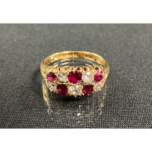 241 - A ruby and diamond chequered ring, set with five cushion and four rose cut diamonds and five red rub... 